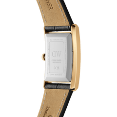 Close-up of the back of the Daniel Wellington Bound Black Crocodile Gold watch, highlighting the stainless steel case, gold edges, and premium black crocodile-embossed leather strap with beige lining.
