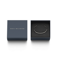 Classic Bracelet Graphite by Daniel Wellington presented in elegant packaging, featuring a slim graphite cuff with engraved branding, ideal as a stylish gift for everyday wear.