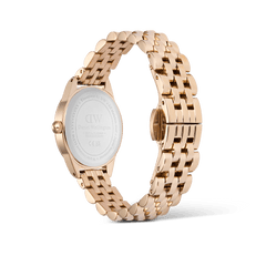 Back view of the Ophelia Mini Emerald Rose Gold watch showing the engraved stainless steel case back, rose gold beans link bracelet, and butterfly clasp.