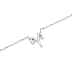 A delicate silver chain necklace featuring an Aquarius zodiac pendant, crafted in silver and set with sparkling crystals for a refined, minimalist look.