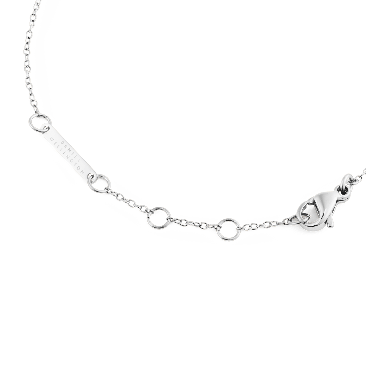 Detail of the Mirelle Solitaire Bracelet Silver showing the adjustable chain with multiple loops, a secure lobster clasp, and discreet Daniel Wellington branding on the polished stainless steel plate.