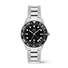 Stainless steel men’s watch with a black ceramic bezel, bold black dial, and silver link bracelet, featuring a GMT function and date display for versatile everyday and travel wear.