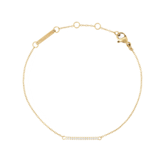 Slim gold Mirelle Eternity Bracelet featuring a fine adjustable chain and a delicate bar set with sparkling white cubic zirconia stones, designed for a subtle and elegant look.