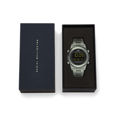 Retro Digital Dark Green watch with a transparent dark green link bracelet and round black digital dial, presented in a Daniel Wellington gift box.
