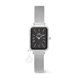 Rectangular silver women’s watch with a black mother of pearl dial, crystal-set bezel, silver mesh strap, and a removable zodiac charm, blending elegant design with a touch of personalisation.