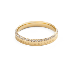 Classic Aura Ring Gold featuring a minimalist gold band with engraved branding and a row of white cubic zirconia crystals along the top edge.