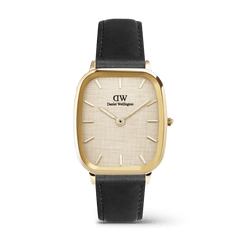 Classic men's watch with a cushion-shaped gold case, linen-textured dial, minimalist gold hour markers, and a black leather strap, showcasing the refined and versatile design of the Marlon Sheffield Linen Gold by Daniel Wellington.