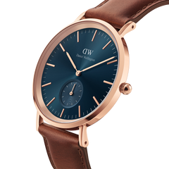 Classic Multi-Eye St Mawes Arctic Rose Gold men's watch with a round rose gold case, deep blue chronograph dial, and genuine brown leather strap, shown in a close-up angled view.