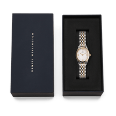 Ophelia Mini Two Tone Gold ladies watch with a gold and silver link bracelet and oval case, presented in a black Daniel Wellington gift box.