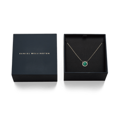 Audrey Necklace Malachite Gold presented in a Daniel Wellington gift box, featuring a gold chain and a green malachite pendant with a halo of white cubic zirconia crystals.