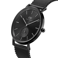 Classic Multi-Eye Ashfield Onyx men's watch with a 40mm black dial, minimalist hour markers, and a black mesh stainless steel strap, shown in a close-up angled view highlighting its sleek, modern design.