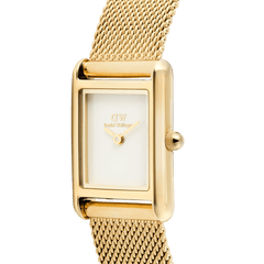 Close-up of the Bound Mini Evergold gold watch showing its rectangular white dial, polished gold case, and fine gold mesh strap, highlighting the elegant minimalist design and quality craftsmanship.