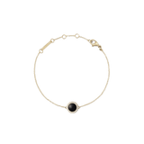 Delicate gold bracelet featuring a slim adjustable chain, a round black agate stone pendant framed by sparkling white crystals, and a secure lobster clasp.