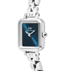 Close-up of the Quadro Mini Arch 3-link Arctic Sunray Silver watch, highlighting its rectangular stainless steel case, polished silver bracelet, and deep blue minimalist dial.