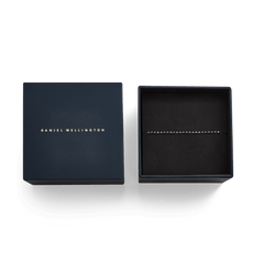 Black Crystal Tennis Bracelet presented in an elegant Daniel Wellington gift box, highlighting its sleek black finish and sparkling crystals for a sophisticated gifting experience.