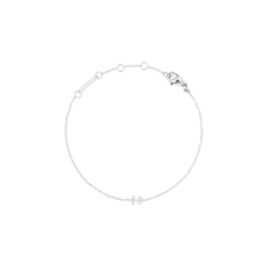 Delicate silver chain bracelet featuring an adjustable fit and a small crystal-encrusted zodiac charm, designed for a minimalist and modern look.