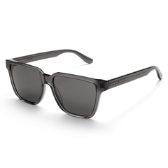 Rectangular Bio-Acetate Grey Grey sunglasses featuring a transparent grey oversized frame, matching grey UV400 lenses, and Daniel Wellington branding on the temple for a stylish and durable look.