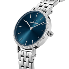 Petite Lumine Bezel 5-Link Arctic S featuring a stainless steel 5-link bracelet, sparkling crystal bezel, and a striking deep blue sunray dial, shown in a close-up angle highlighting its refined details.