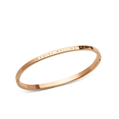 Classic Bangle Rose Gold featuring a slim, polished rose gold finish with the DANIEL WELLINGTON logo engraved on the outer edge, highlighting its minimalist and elegant design.