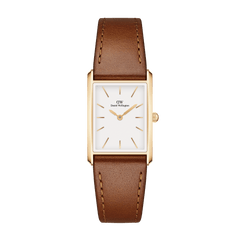 Bound Durham Gold ladies watch with a rectangular gold case, minimalist white dial, gold markers, and a light brown leather strap, designed for everyday elegance and versatility.