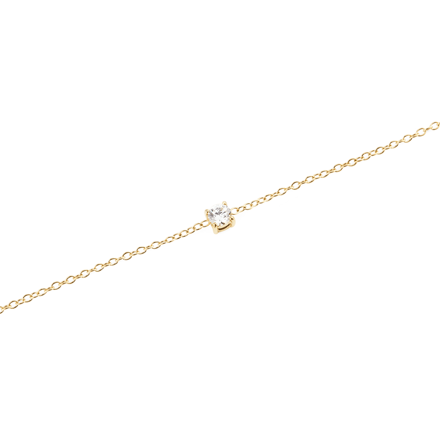 Close-up of the Mirelle Solitaire Bracelet Gold, highlighting the fine gold chain and the single white cubic zirconia stone set in a minimalist style.