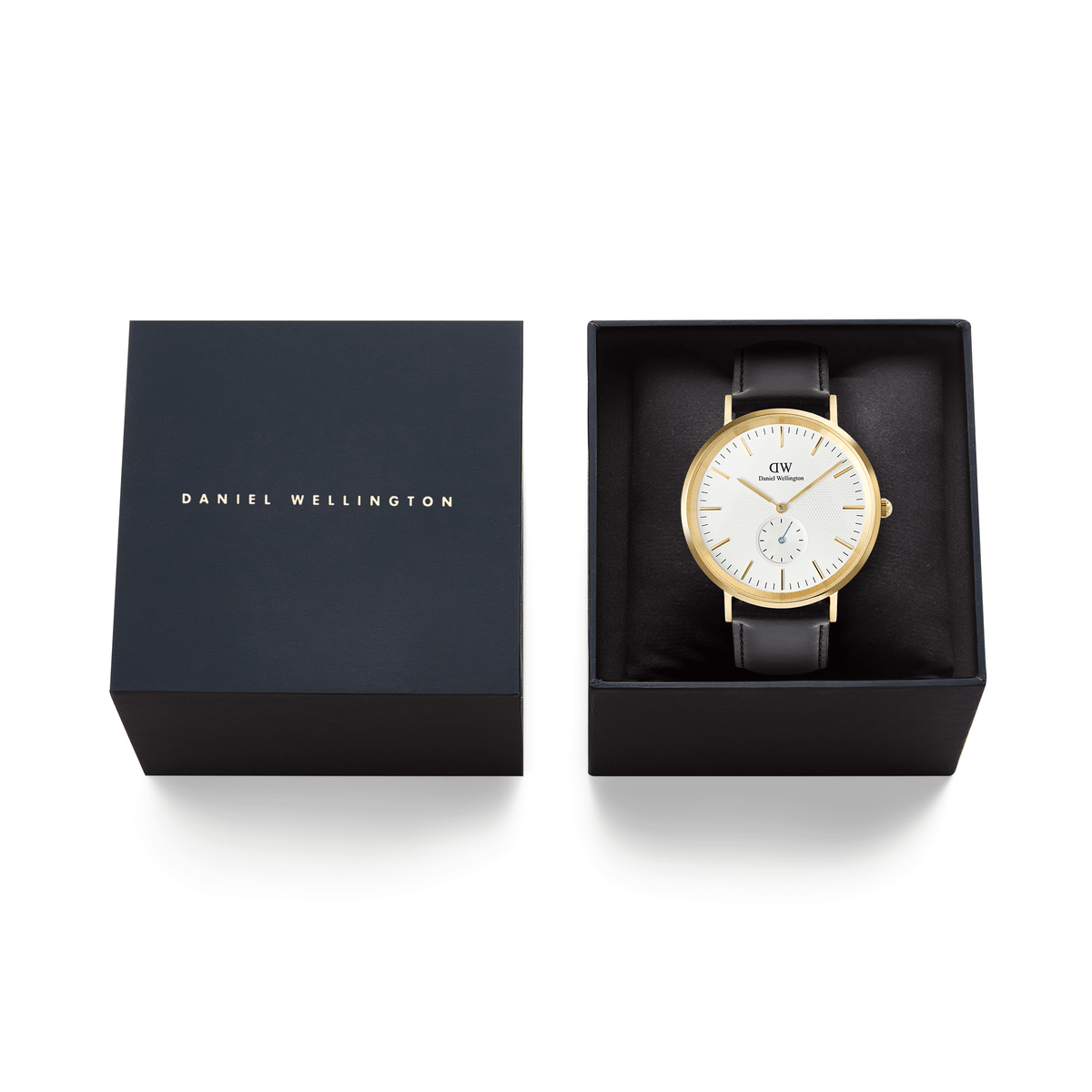Classic Multi-Eye Sheffield Off-white Sunray Gold men's watch with a gold case and black leather strap, presented in a branded Daniel Wellington gift box.
