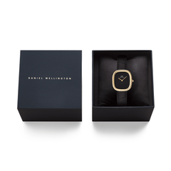 Margot Reading Onyx Ceramic Gold ladies watch presented in a Daniel Wellington gift box, featuring a gold-tone rectangular case, minimalist black dial, and black croco-embossed leather strap, ideal for gifting.
