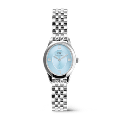 Ophelia Mini Ice Blue Silver women’s watch featuring a petite oval case, polished silver 5-link bracelet, and an ice blue sunray dial with Roman numerals, blending modern elegance with a timeless design.