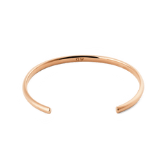 Arch Cuff Rose Gold 4mm shown from above, highlighting its slim, open-ended shape and polished rose gold finish with a discreet logo on the inside for a refined, minimalist look.