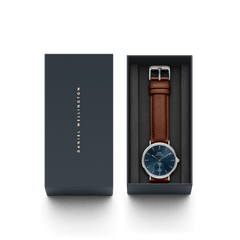Classic Multi-Eye St Mawes Arctic Silver men's watch with a deep blue dial and brown leather strap, presented in a branded Daniel Wellington gift box.