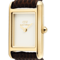 Close-up of the Bound Mini Dark Brown Lizard Gold watch showing its rectangular gold case, minimalist white dial, and textured brown lizard grain leather strap.