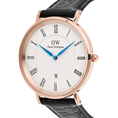 Classic Roman Numerals Date Black Croc Belly Rose Gold watch with a rose gold case, white dial featuring black Roman numerals, blue hands, a date window at six o’clock, and a black croc-embossed leather strap.