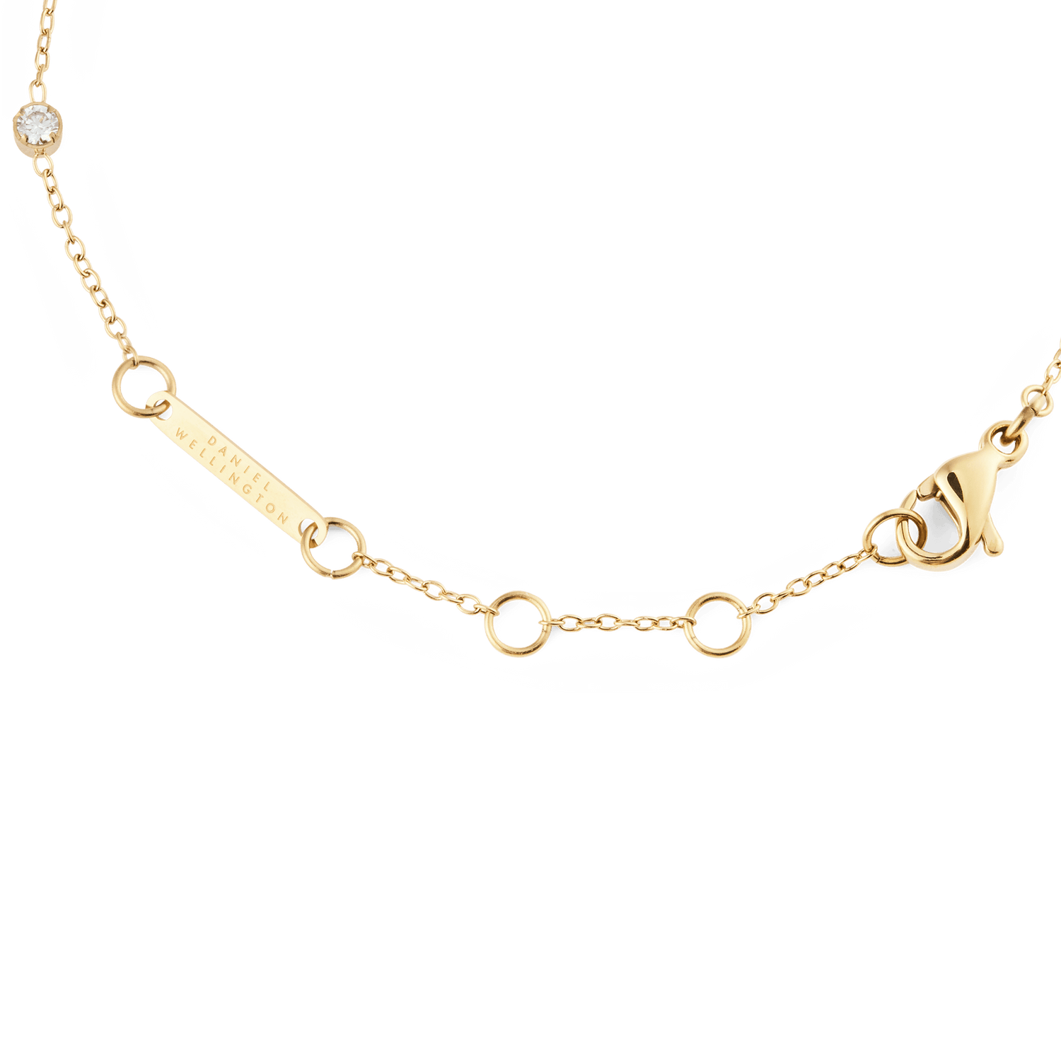 Detail of the Pearl Bracelet Gold showing the adjustable gold chain with a secure lobster clasp, Daniel Wellington branding, and a single cubic zirconia stone.