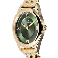Close-up of the Ophelia Mini Emerald Gold watch showing its oval gold case, emerald green sunray dial, gold Roman numerals, and polished gold bracelet.
