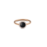 Rose gold ring featuring a round black agate centre stone surrounded by a halo of white crystals, set on a slim, polished band.