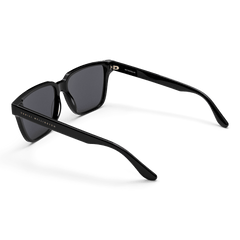 Rectangular Bio-Acetate Black sunglasses with a contemporary oversized frame, featuring dark lenses and Daniel Wellington branding along the temple for a stylish, durable finish.
