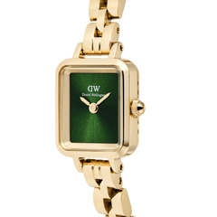 Close-up of the Quadro Mini Arch 3-link Emerald Sunray Gold watch, showing the rectangular gold case, polished gold bracelet, and vibrant emerald green sunray dial.