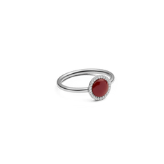 Audrey Ring Red Agathe Silver featuring a slim silver band with a deep red agate stone and a halo of white cubic zirconia crystals, shown from a side angle to highlight its elegant setting.