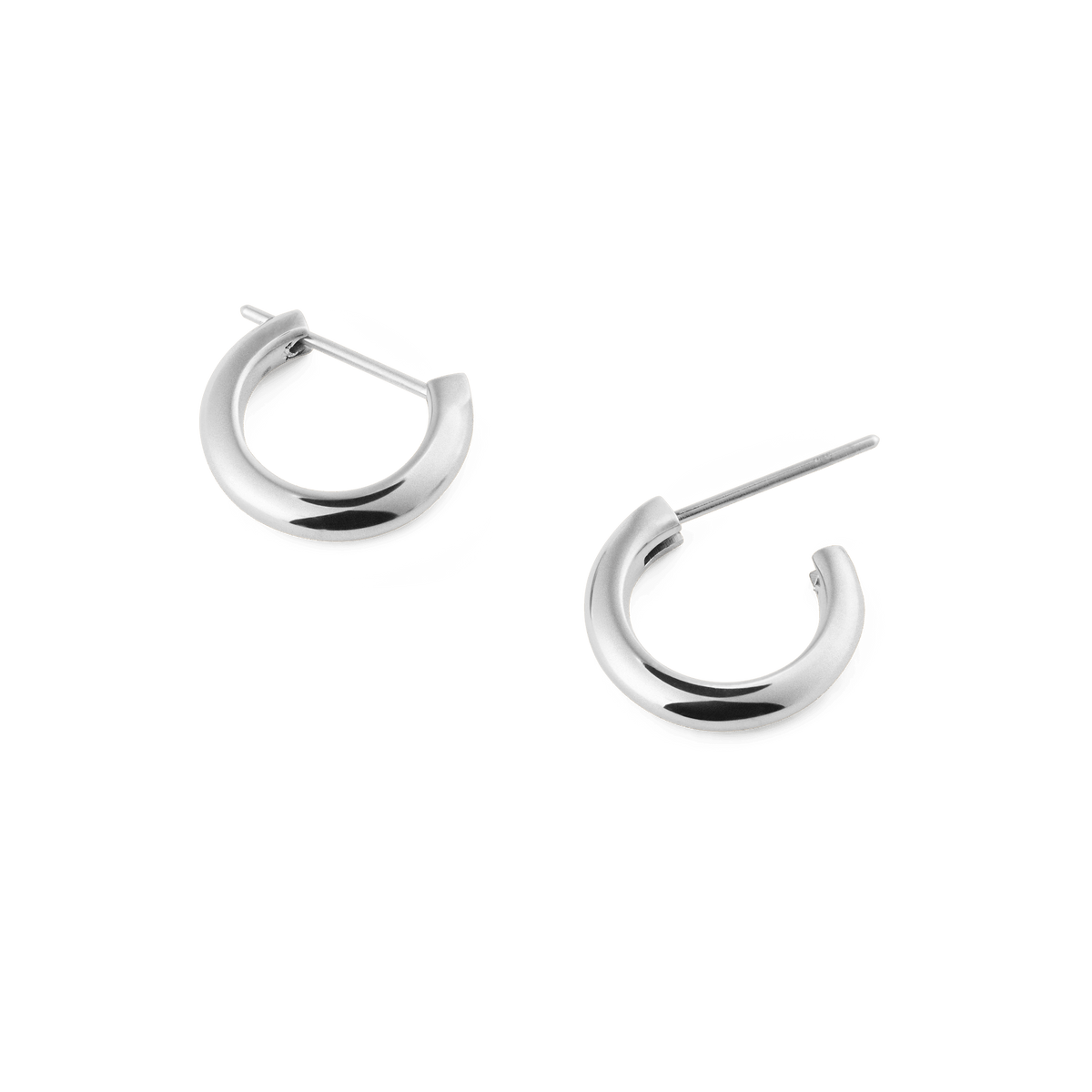 Arch Earring Silver 9mm features two small, polished stainless steel hoop earrings with a minimalist curved shape and classic pin closure, ideal for everyday wear.