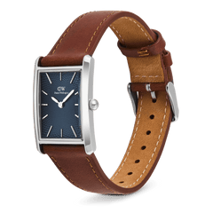 Daniel Wellington Bound Light Brown Arctic Guilloché Silver watch with a rectangular silver case, deep blue guilloché dial, and adjustable light brown leather strap, shown in a side angle to highlight its slim profile and classic styling.