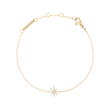 Delicate gold bracelet featuring a star-shaped charm set with white cubic zirconia stones on a fine adjustable chain, designed for a subtle and elegant look.