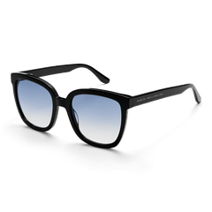 Grande Bio-Acetate Black Blue sunglasses featuring an oversized square black frame, blue gradient UV400 lenses, and Daniel Wellington branding on the arm, designed for stylish comfort and reliable sun protection.