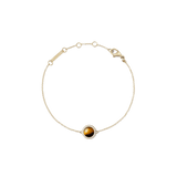 Delicate gold bracelet featuring a central tiger eye stone framed by a halo of white cubic zirconia, with an adjustable fine chain and secure lobster clasp.
