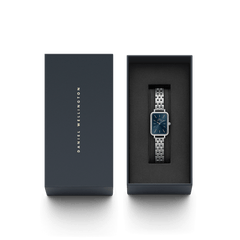 Quadro Lumine Bezel 5-Link Arctic Silver ladies watch with a blue dial and gemstone bezel, presented in a premium Daniel Wellington gift box.