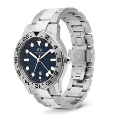 Daniel Wellington Iconic GMT Link Brushed Bezel Silver watch with a blue dial, brushed silver 24-hour bezel, and stainless steel link bracelet, shown with the butterfly clasp open.