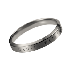 Classic Ring Graphite featuring a sleek graphite-toned stainless steel band with engraved Daniel Wellington branding, shown against a plain background to highlight its minimalist design and refined finish.