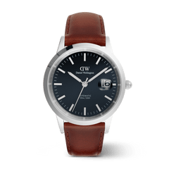 Men’s automatic watch with a polished silver case, arctic blue enamel dial, glow-in-the-dark markers and hands, and a brown Italian leather strap.