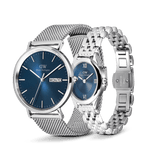 Classic Day & Ophelia Mini Arctic Silver Set featuring a men’s watch with a textured blue dial, day display, and silver mesh strap, paired with an elegant oval women’s watch with a blue dial, Roman numerals, and a polished silver link bracelet.