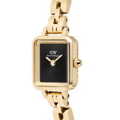Close-up of the Quadro Mini Arch 3-link Onyx Sunray Gold ladies watch, showing its rectangular gold case, minimalist black dial, and polished gold-plated stainless steel bracelet.