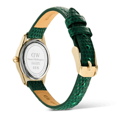 Back view of the Daniel Wellington Ophelia Mini Green Lizard White Guilloché Gold watch, featuring a polished gold case, engraved case back, and a green lizard-embossed leather strap with a gold pin buckle.